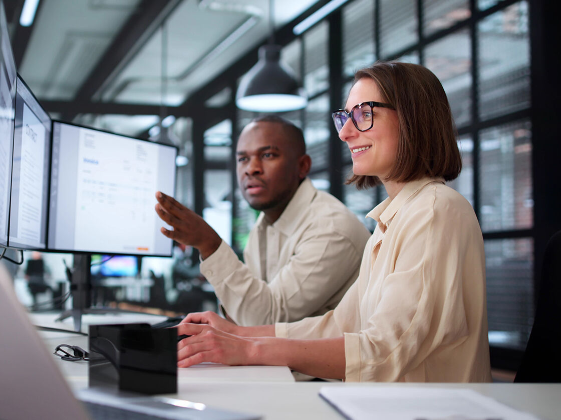 Finance team reviewing a digital invoice on screen